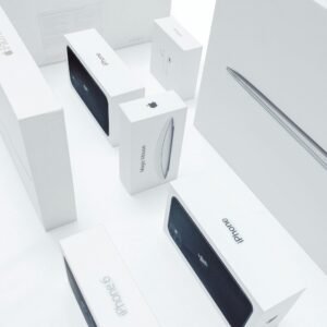 Aerial view of various Apple product boxes showcasing sleek design and branding.